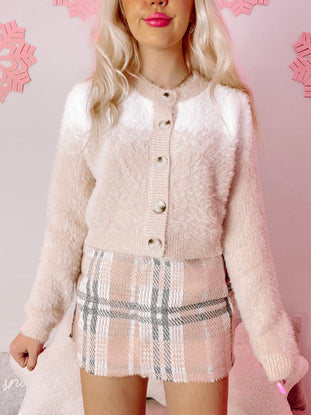 Cream & white fuzzy Snow Day cardigan with button closure; perfect for cozy winter style.
