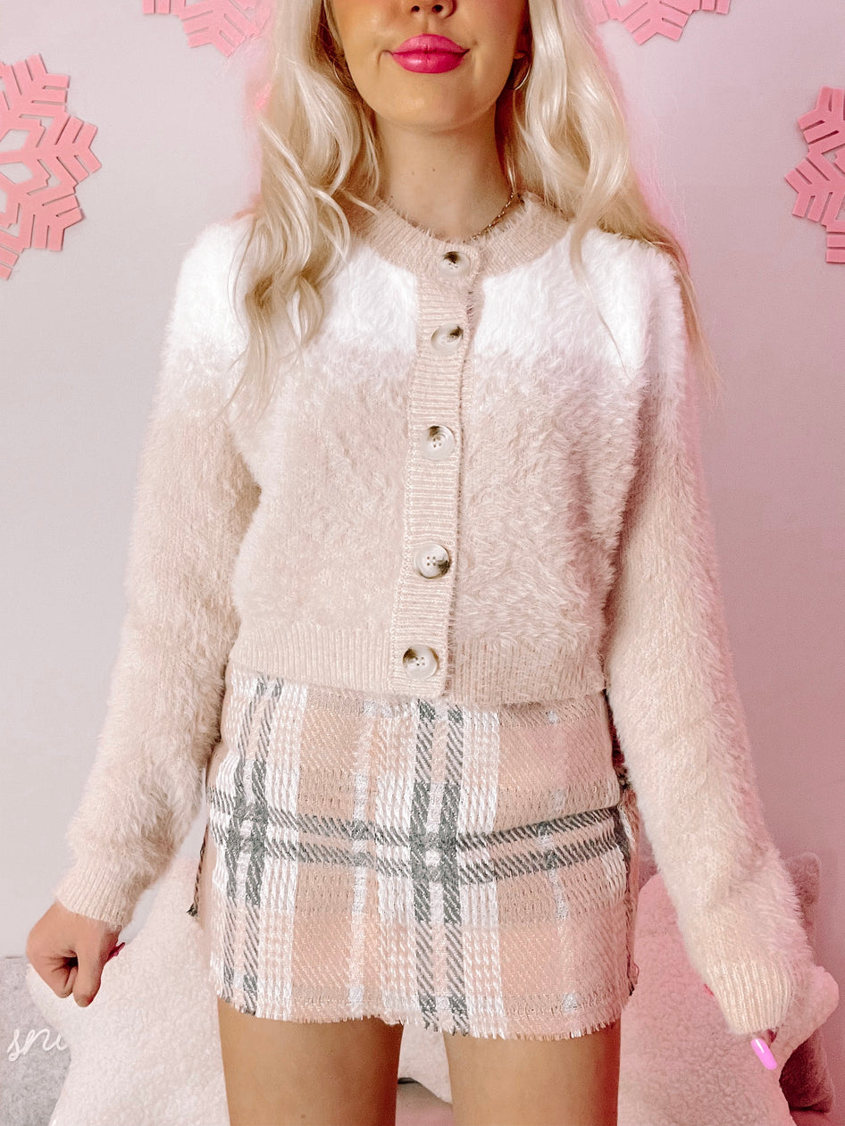 Cream & white fuzzy Snow Day cardigan with button closure; perfect for cozy winter style.
