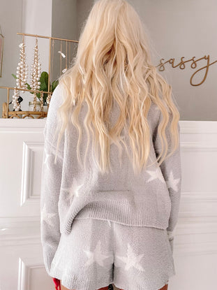 Cozy light gray star-patterned lounge set, shown from the back.
