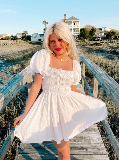 White Lydia dress,  square neck, puff sleeves, smocked bodice, perfect for summer.
