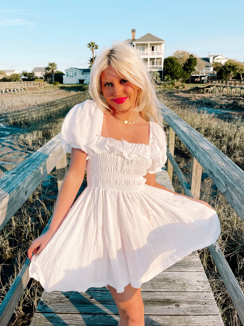 White Lydia dress,  square neck, puff sleeves, smocked bodice, perfect for summer.
