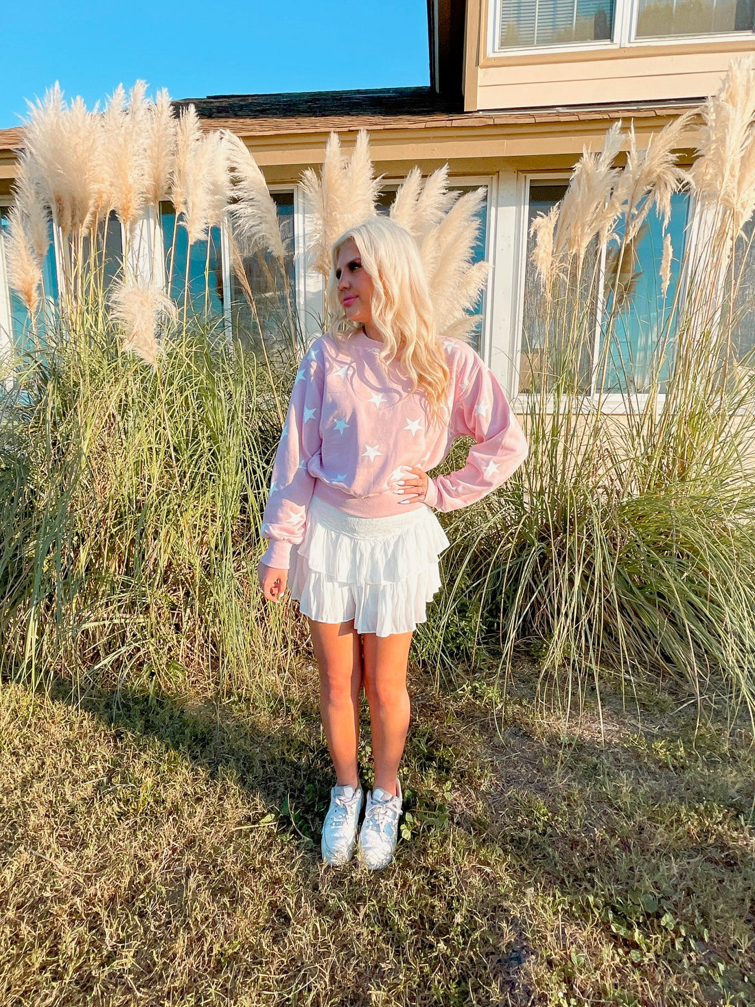 Pink Stargazer sweatshirt with white star print
