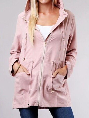 Blush-colored hooded jacket with zipper and pockets, shown on a model.
