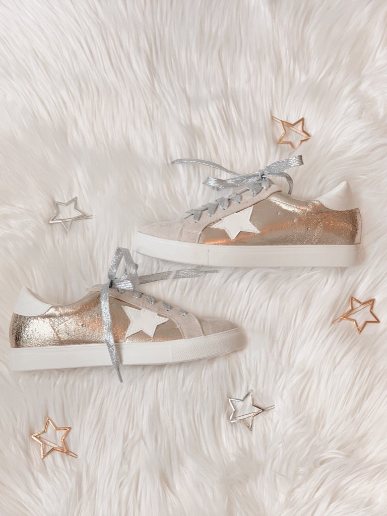 Starstruck Sneakers: Gold metallic low-top sneakers with white star detail.
