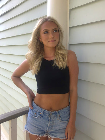 Black ribbed crop top and light wash denim shorts, summer fashion lifestyle.
